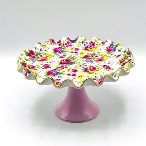 Style by Lava fluted floral dessert plate on lavender pedestal.